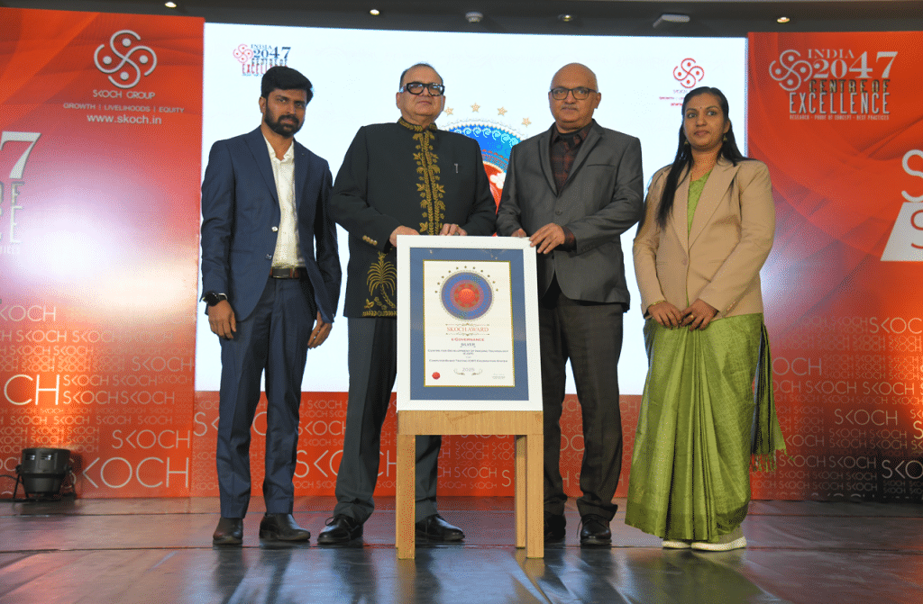 C-DIT Director Shri Jayaraj G., Senior Software Engineer Smt. Kavitha T.K., and Project Manager Shri Krishnakumar S. receiving the SKOCH Silver Award.